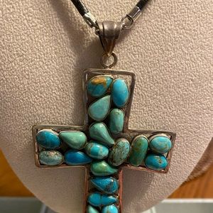 Artisan Jewelry - Turquoise stone cross shaped pendant on leather Artisan Jewelry - Turquoise stone cross shaped pendant on leather
